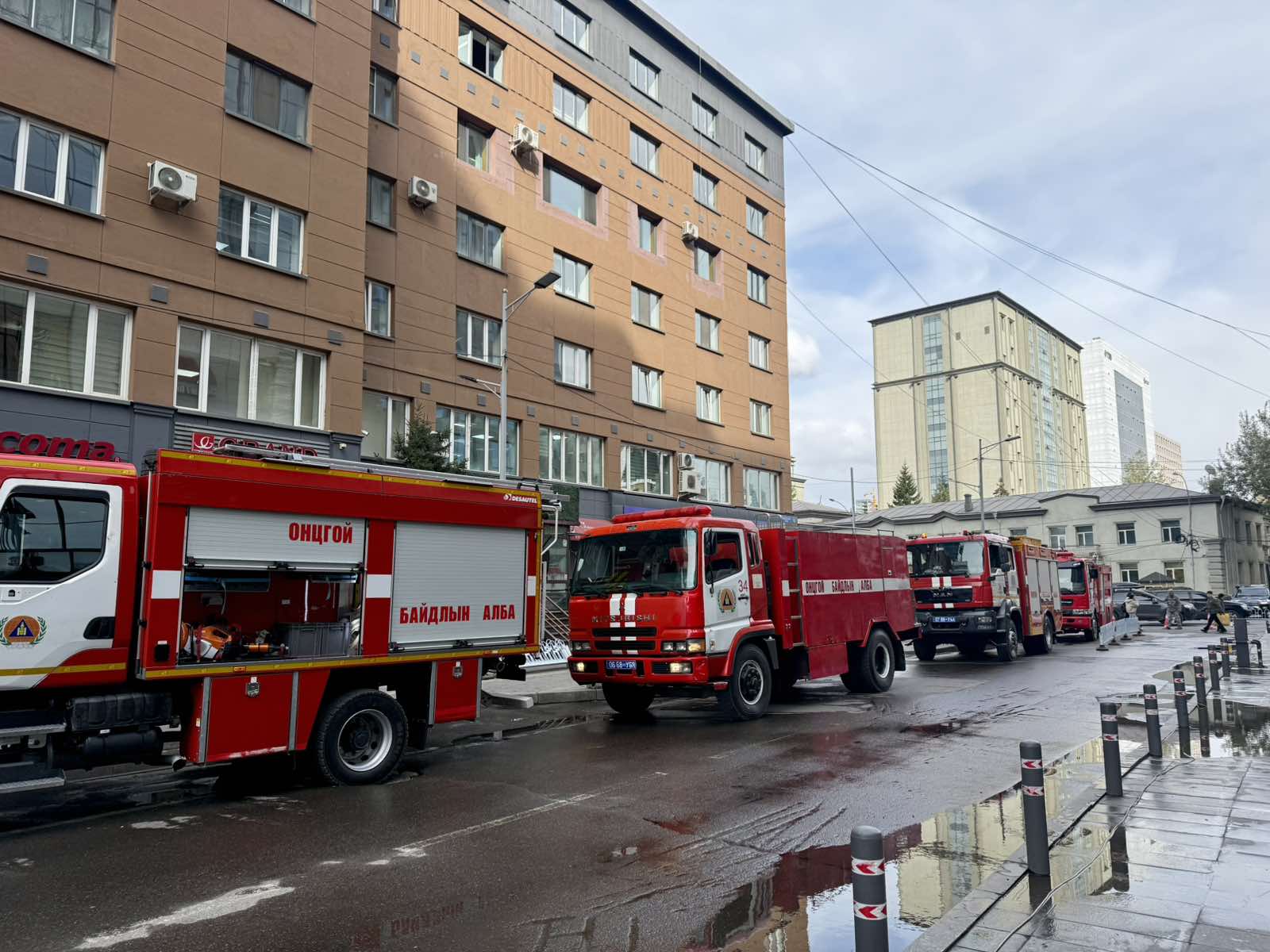 Emergency service fire engines lined up along the street